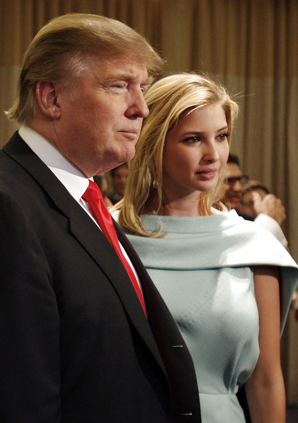 Donald Trump and his daughter, Ivanka, pose for photographers at the Trump Soho Hotel in New York April 9, 2010. The first Trump Hotel built in Downtown New York, a 46-story, 391-room luxury hotel condominium, opened to guests on Friday. REUTERS/Jessica Rinaldi (UNITED STATES - Tags: ENTERTAINMENT BUSINESS SOCIETY TRAVEL)
